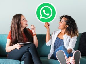 young-women-showing-whatsapp-messenger-icon