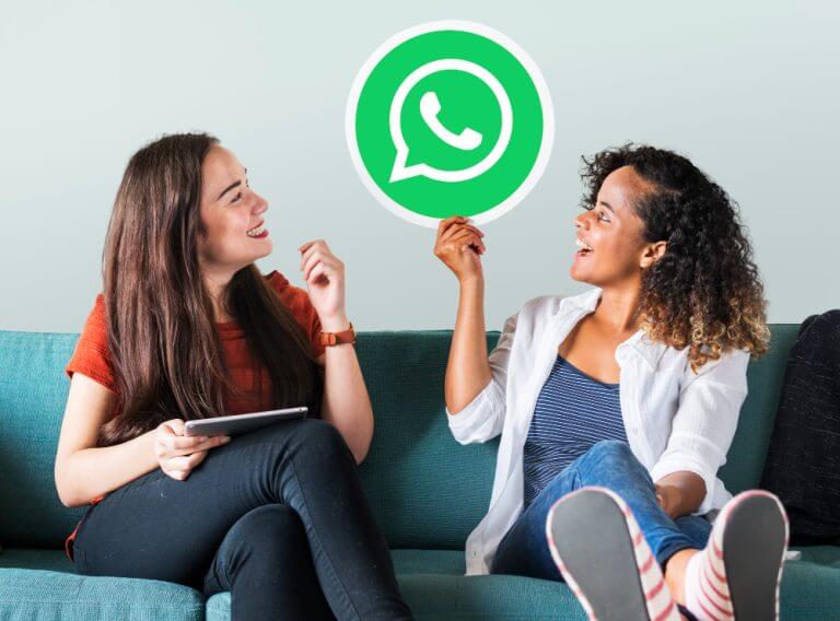 young-women-showing-whatsapp-messenger-icon