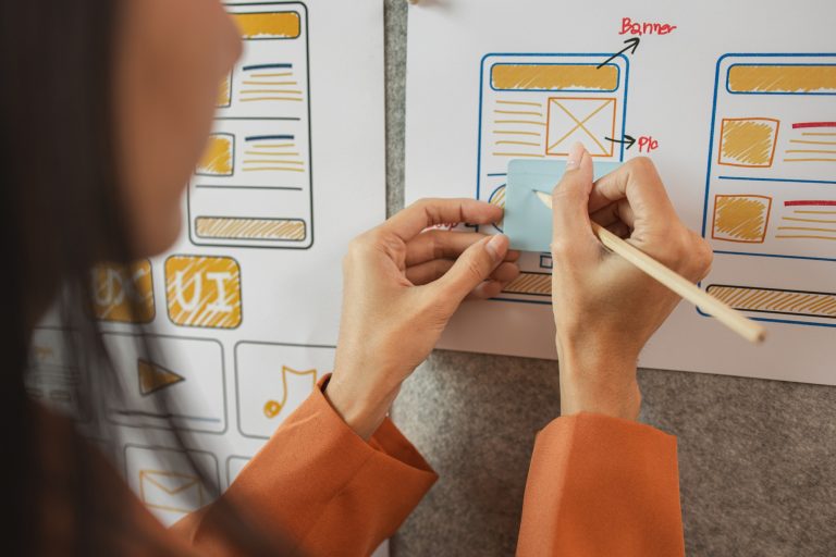 UI UX designers team working on new website wireframe in office
